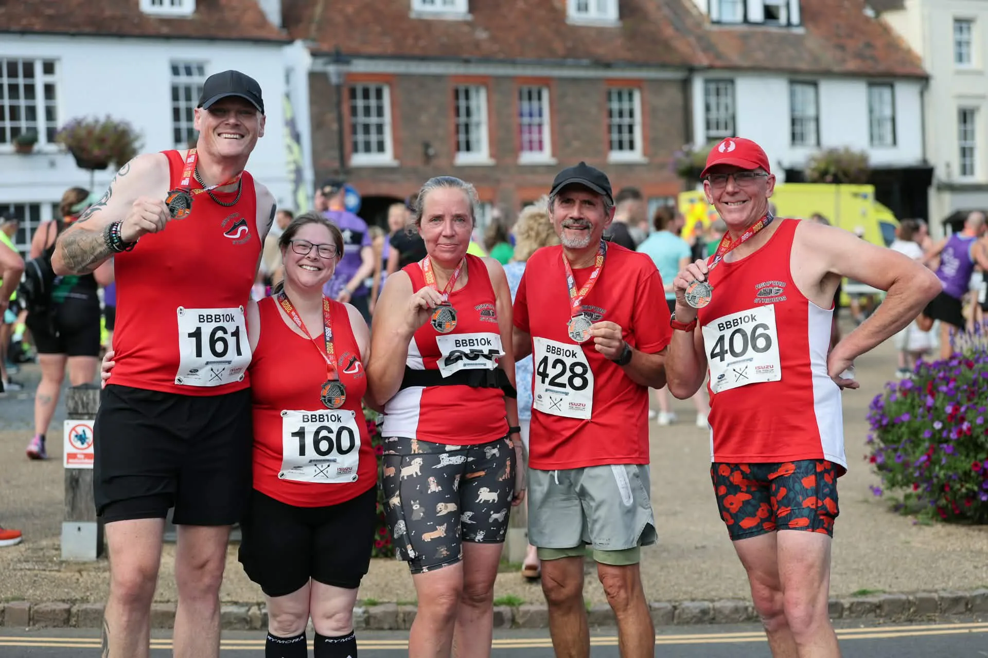 A group of runners celebrating together after finishing the BBB10k